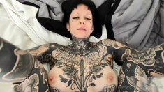 A super sexy brunette massages her big boobs