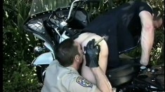 Two cops meet in the bushes for tryst of cock sucking and ass banging